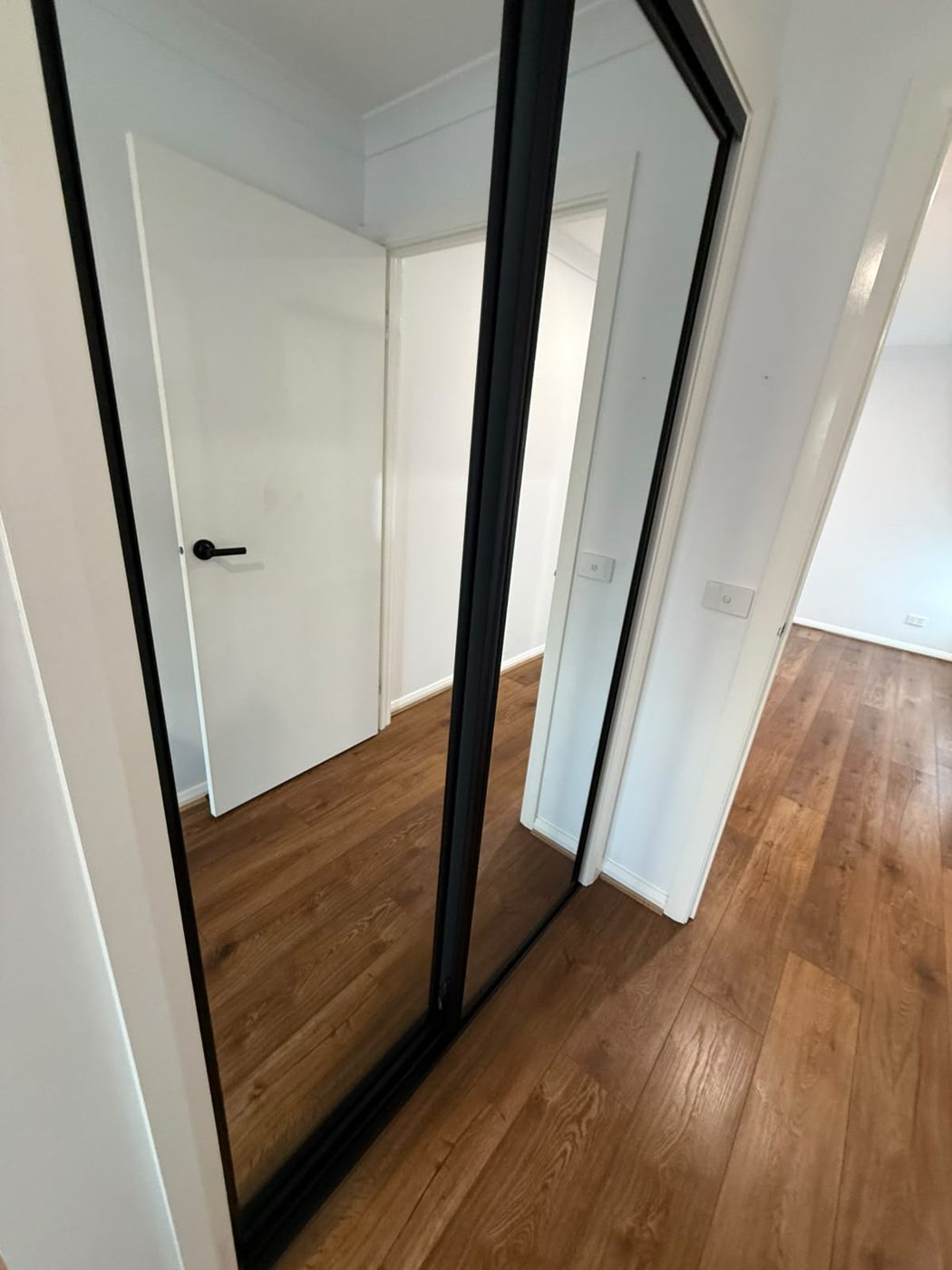 Clean hallway with mirrored robes